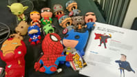 Superhero toys next to the precon handout.