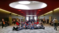 Attendees on bean bags eating lunch.