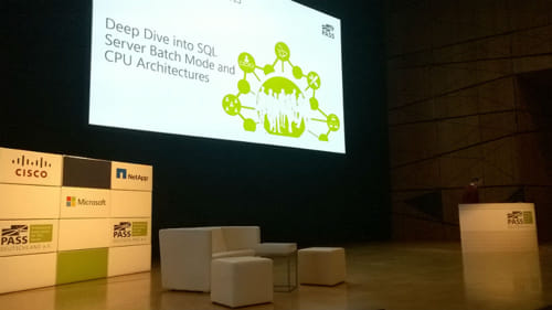 Chris Adkin behind a podium on stage presenting at SQLKonferenz 2015.